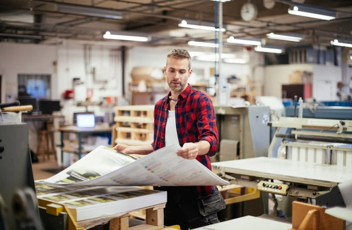 Print shop employee creating large inkjet prints