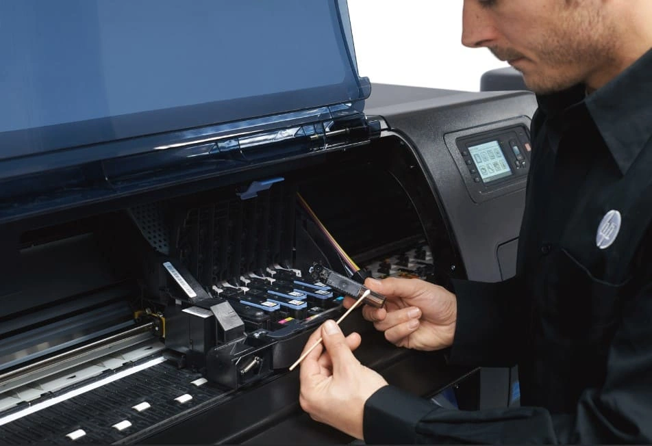 HP plotter technician preparing a plotter for safe disposal