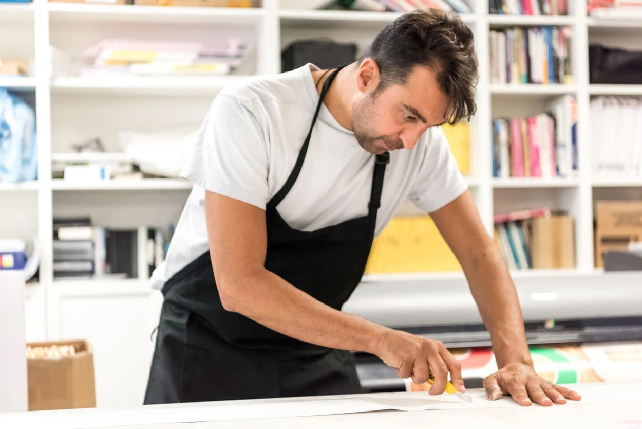 Print shop employee providing excellent service