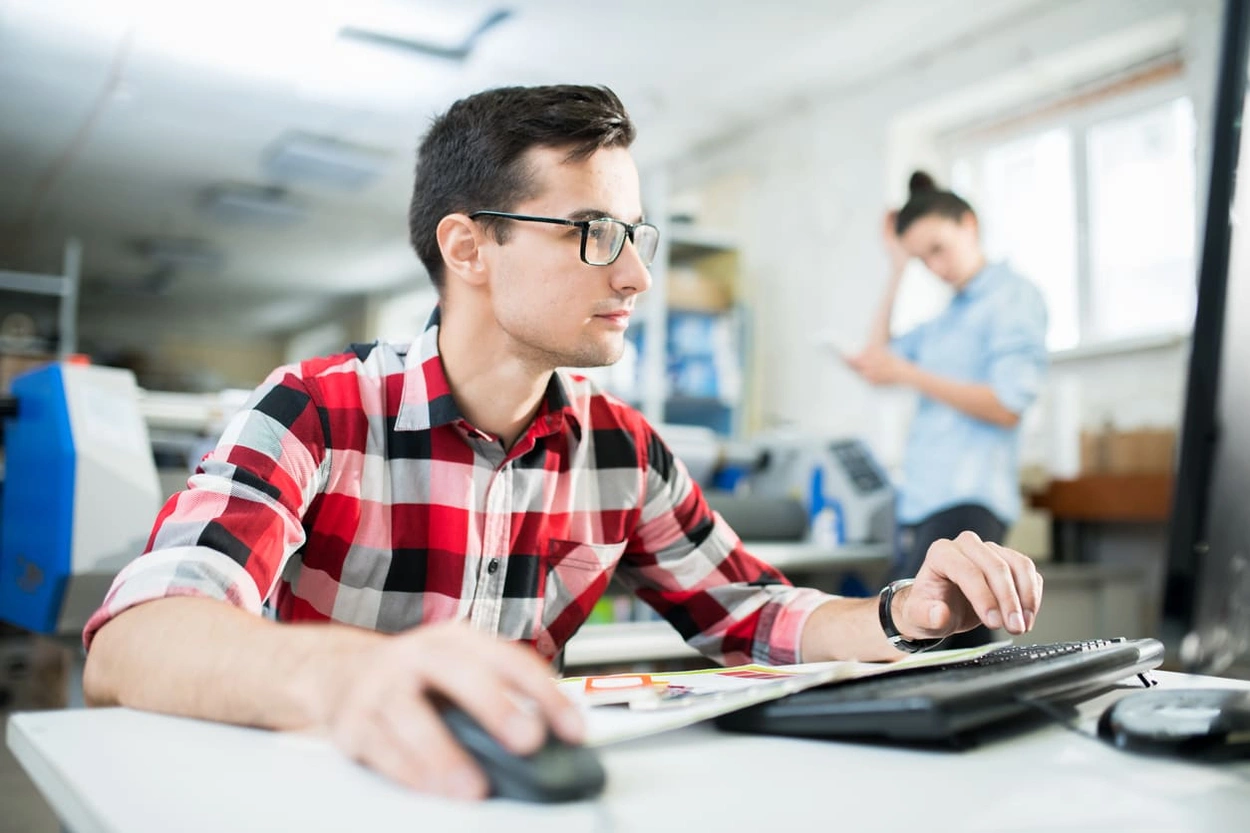 Printing press employee looking up 'what is an ICC profile in printing' to complete specialty projects Printing press employee looking up 'what is an ICC profile in printing' to complete specialty projects