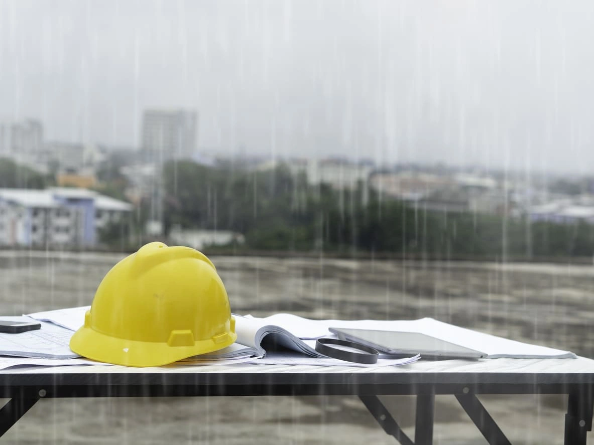 Blueprints caught in the rain at a construction site Blueprints caught in the rain at a construction site