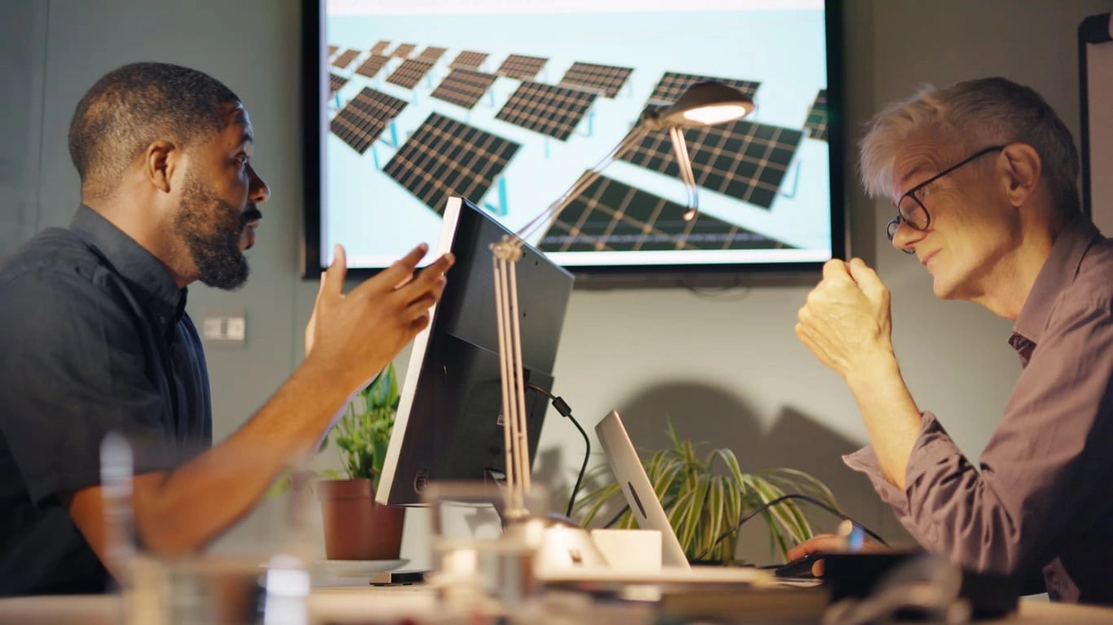 AEC coworkers discussing green building standards
