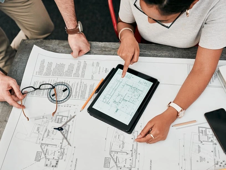 AEC coworkers seeing how a large architectural rendering printout accurately captures every detail