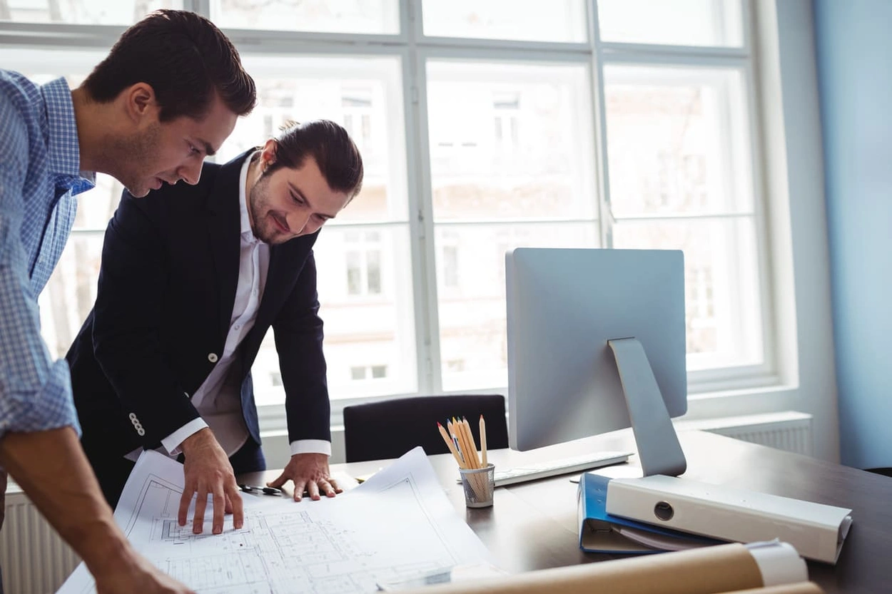 Two AEC professionals looking into the ROI on equipment purchases including on large-format printers.