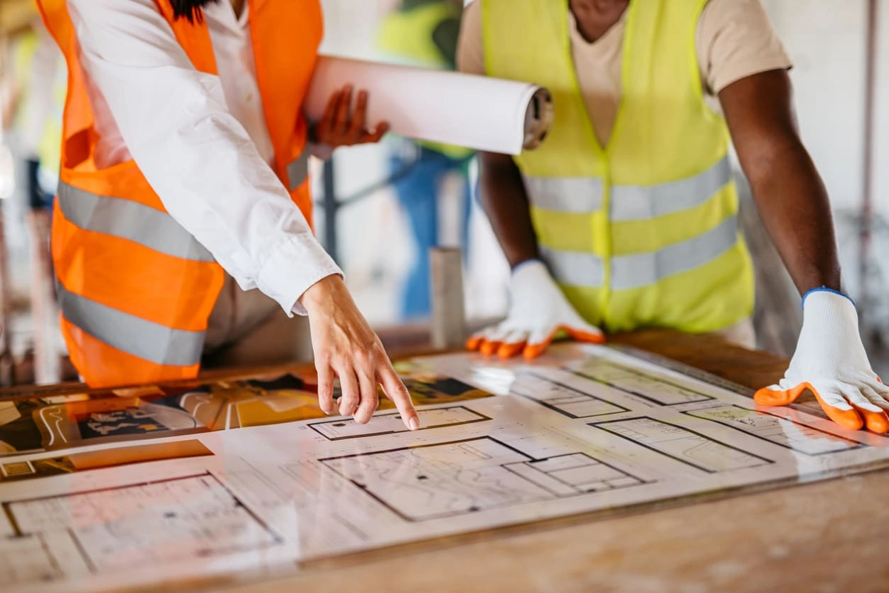 Safety professionals assessing print emergency maps to make updates