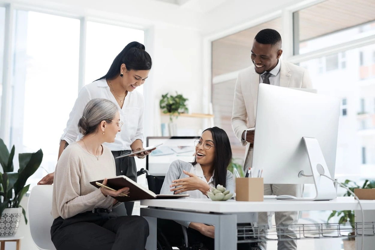 Coworkers collaborating in an office with smart building automation