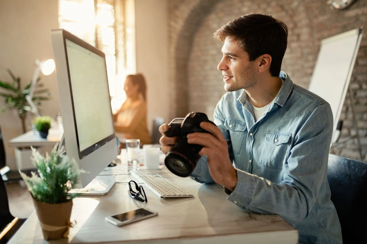 Professional photographer processing photos before printing with the best large format printers for photographers
