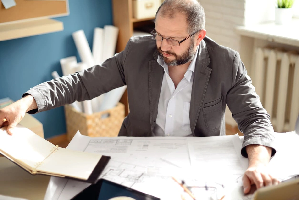 Executive determining typical print costs to determine next steps in reducing printing costs